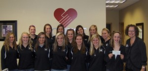 Frazee girls volleyball team. Far R  Katie Smith presents check to Joy Crouch HRRV