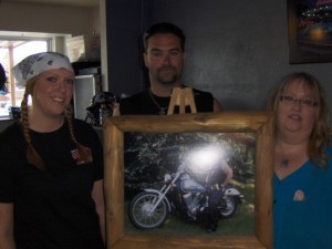 L-R Jessica Sonnenberg, Justin Helmke, Kris Barten and photo of Ole Barten